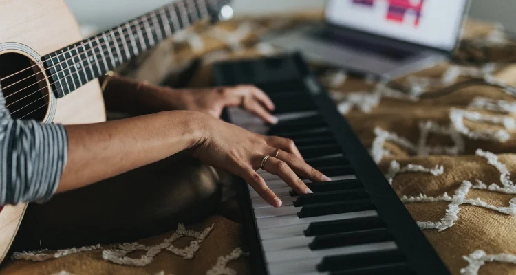 woman playing midi keyboards
